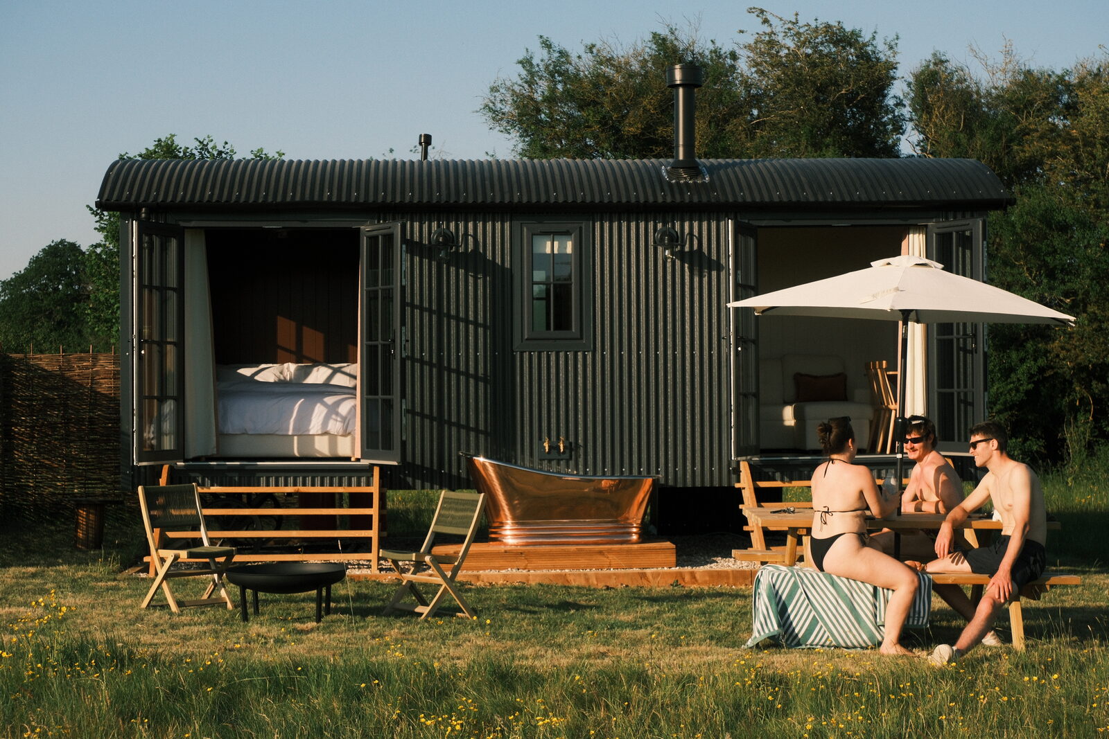Shepherd's hut in a meadow at golden hour