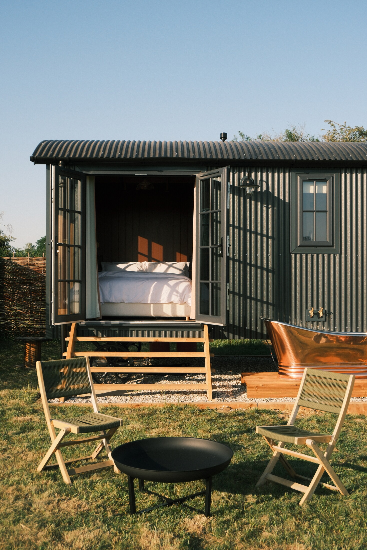 Shepherd's hut with copper bath and fire pit
